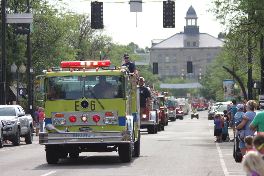 Littleton's Fire Muster begins with a fire truck parade down Main Street.